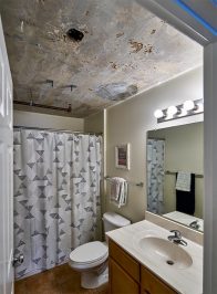 Image Of A Bathroom With A Sink, Mirror, Toilet And Shower