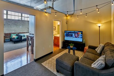 Image Of A Living Room With Views Into The Bathroom And Bedroom