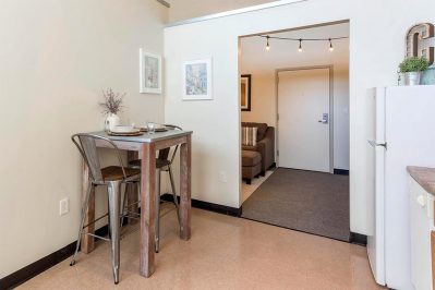 Image Of A Dining Area And Front Door